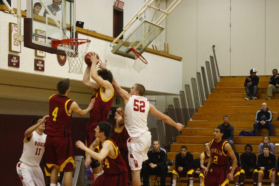 Junior Andrew Fox goes in for a basket against Wabash College.
