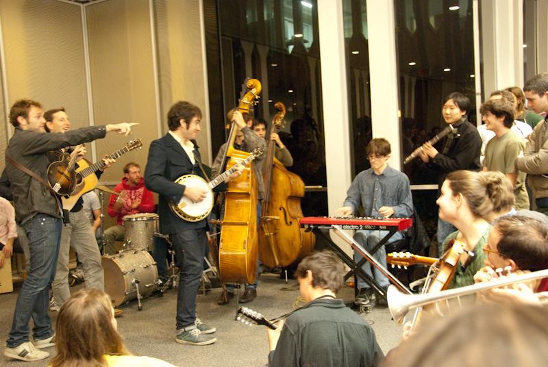 Singer and mandolinist Chris Thile jams out on the mandolin as students join in. Punch Brothers held an informal jam session in the Conservatory lounge Tuesday evening, covering classics by The Band and Randy Newman, as well as folk and bluegrass standards.