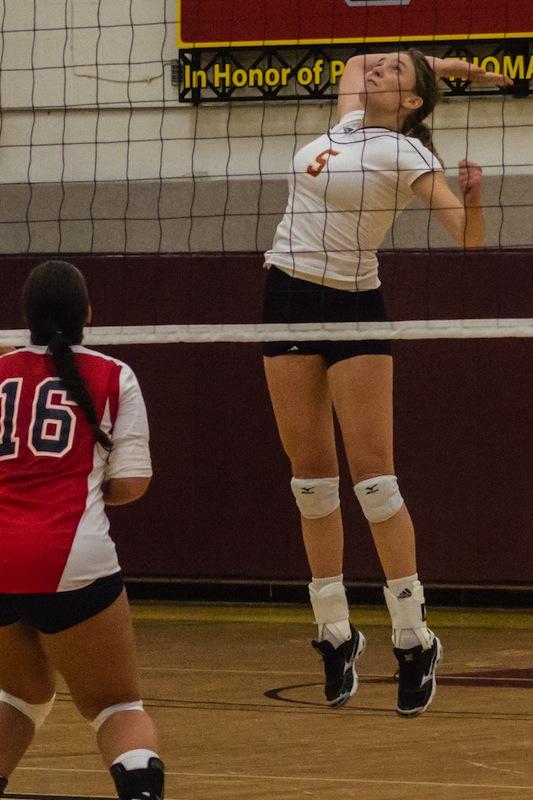 Senior Laura Jessee jumps for a spike during a recent match. Jessee earned All-Conference honors this season, finishing with 1,054 career kills.