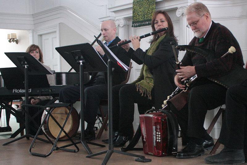 Members of local band Turn the Corner perform traditional Irish music at the First Church in Oberlin. The charity event was organized by Family Promise of Lorain County to help house and feed the local homeless. 