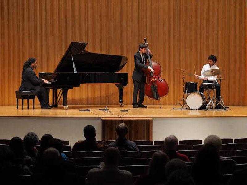 From left, Conservatory senior Shea Pierre on the piano, double-degree fifth-year Daniel Pappalardo on bass and Conservatory senior Miles Labat on drums perform Pappalardo’s original composition, Over the Curve. Their performance was part of the Danenberg Honors Recital, which showcased the top talent from the Conservatory. 