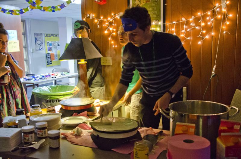French professor and Bailey House’s Faculty-in-Residence Thomas Chevrier spreads crepe batter on a skillet, in keeping with the festival’s French roots. 
