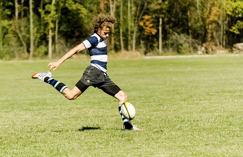 Junior captain Andrew Follmann kicks the ball in a match last fall. The Gruffs will play host to Ohio Wesleyan University on April 12 in their first match of the season.