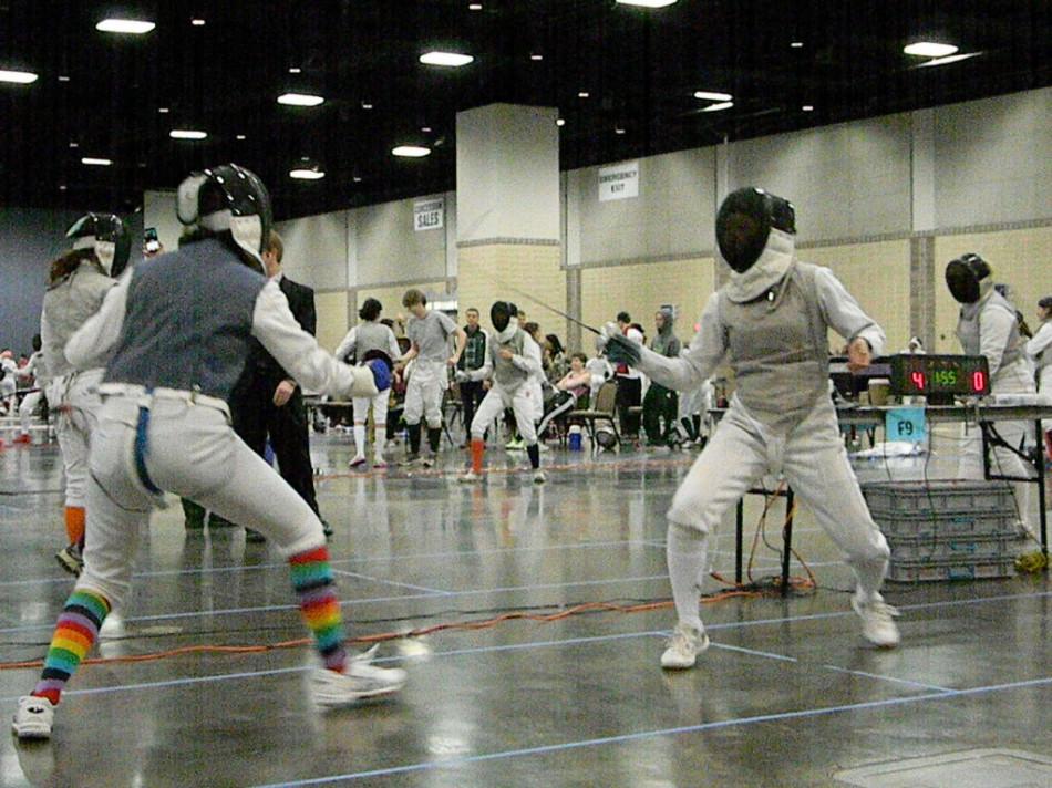 Captain and sophomore Izzy Esler (left) duels an opponent during a tournament in Knoxville, TN. The women’s Flaming Blades squad placed 19th out of 31 teams. 