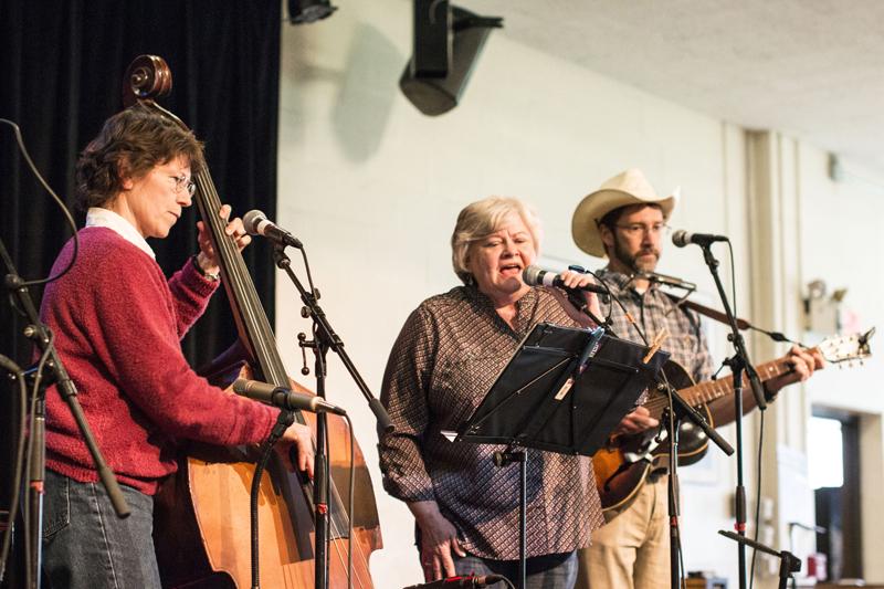 Chair of the Biology Department Mary Garvin (left), Biology Administrative Assistant Twila Colley and Professor of Biology Keith Tarvin make up Twila and the GiTarvins, a folk and country band that played last Friday at the Cat in the Cream as part of Folkfest.