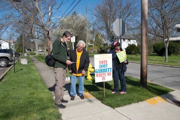Voters converge outside of Philips gym to campaign for Janet Garret, a write-in candidate from Oberlin who ran for U.S. Congress in the Ohio primary election on Tuesday. Some other ballot features included Issue 22, Issue 11 and
the Democratic and Republican primaries.