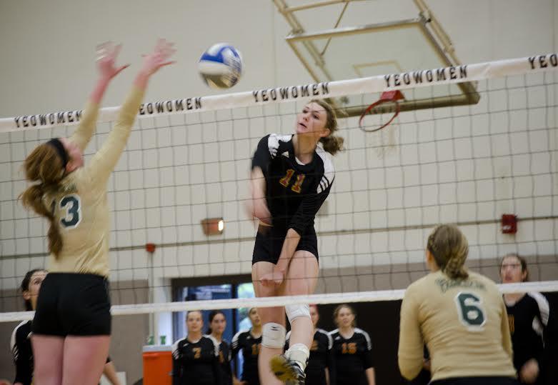 Junior Maddy Dunn spikes the ball in a home game this season. The volleyball team enters a Friday road match against the Capital University Crusaders with a 4–10 record.