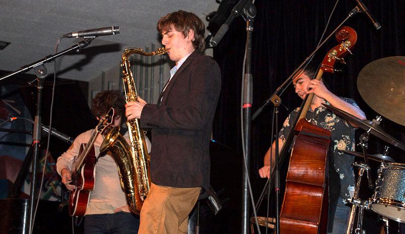 Double-degree+saxophonist+Nathan+Rice+performs+a+solo+during+Tuesday%E2%80%99s+Celebrating+John+Coltrane+Concert.+A+group+of+jazz+musicians+represented+Coltrane%E2%80%99s+diverse+repertoire+with+dynamic+interpretations+of+his+music.