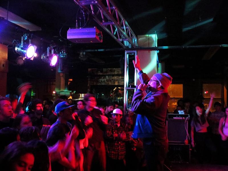An energetic crowd claps and dances at the Blue Scholars ’Sco concert last Friday evening. The Seattle-based hip-hop duo sang about social justice and peace at a successful performance sponsored by the Asia America Art Collective.