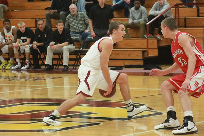 Sophomore Jack Poyle looks past a Wittenberg University defender in a game last Saturday, Nov. 15. Poyle was named NCAC Player of the Week after he scored a career-high 26 points in Saturday’s contest.