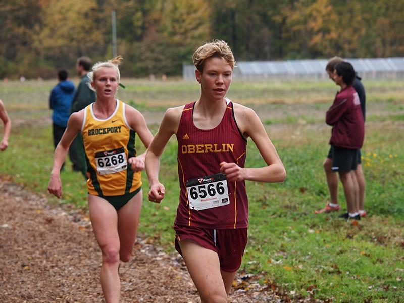 Senior Kyle Neal races past a Brockport University runner at the Inter-Regional Rumble on Oct. 18. The top seven Yeowomen runners and juniors Geno Arthur and Joshua Urso will represent Oberlin in the NCAA championship this Saturday.