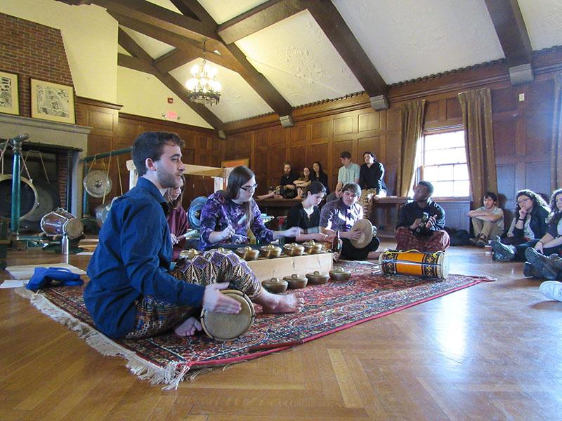 College juniors Alex Frank (left) and Isabelle Rew and College seniors Noelle Hedges-Goettl, Adrian Ziaggi, Edmund Metzold and Shonari Edwards perform a concert of traditional Indonesian gong music. Associate Professor of Ethnomusicology Jennifer Fraser hosted the concert, which took place in Shipherd Lounge in Asia House.