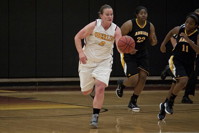 Senior Christina Marquette dribbles down the court past a defender from the opposing Adrian College Bulldogs at home on Wednesday, Nov. 19. The Yeowomen have an overall record of 3–3 this season. 