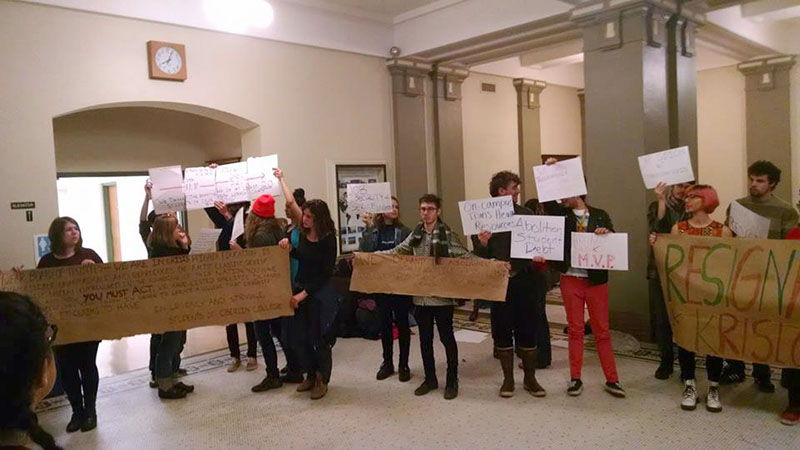 Students+hold+signs+expressing+a+variety+of+demands+outside+Friday%E2%80%99s+trustee+dinner%2C+including+what+many+idenify+as+the+College%E2%80%99s+complicity+in+the+systemic+oppression+of+people+of+color.+This+week%2C+some+are+pressuring+the+administration+to+temporarily+suspend+the+standard+grading+system+in+the+wake+of+nationwide+protests+and+conflict+following+the+deaths+of+Michael+Brown%2C+Eric+Garner+and+Tamir+Rice.