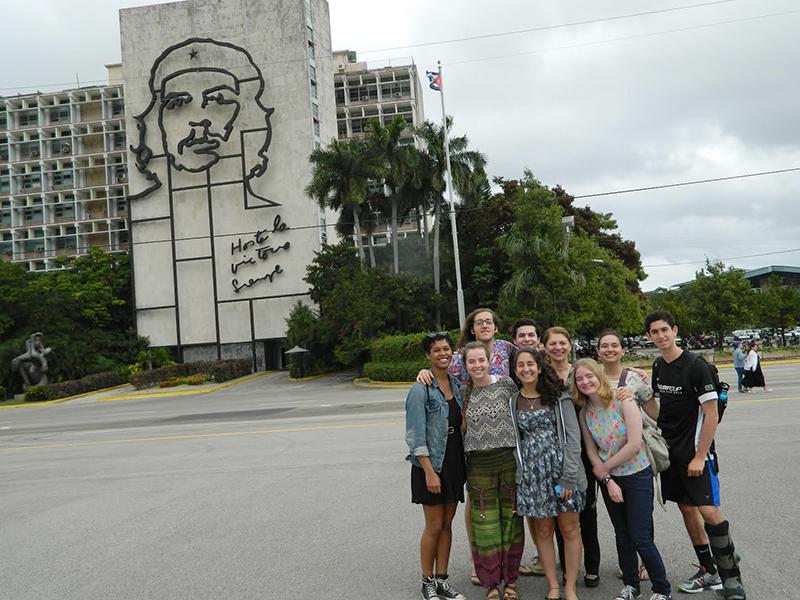 The group stands in the Plaza de la Revolución in Havana, Cuba. Over the course of two weeks, the students traveled to several different parts of Cuba and chatted with residents.