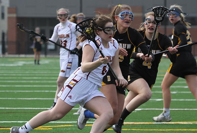 Sophomore attacker Sara Phister works around a defender in a home game against the DePauw University Tigers on March 21. Phister scored six goals in the Yeowomen’s 17–16 overtime loss to the Wittenberg University Tigers on Tuesday.