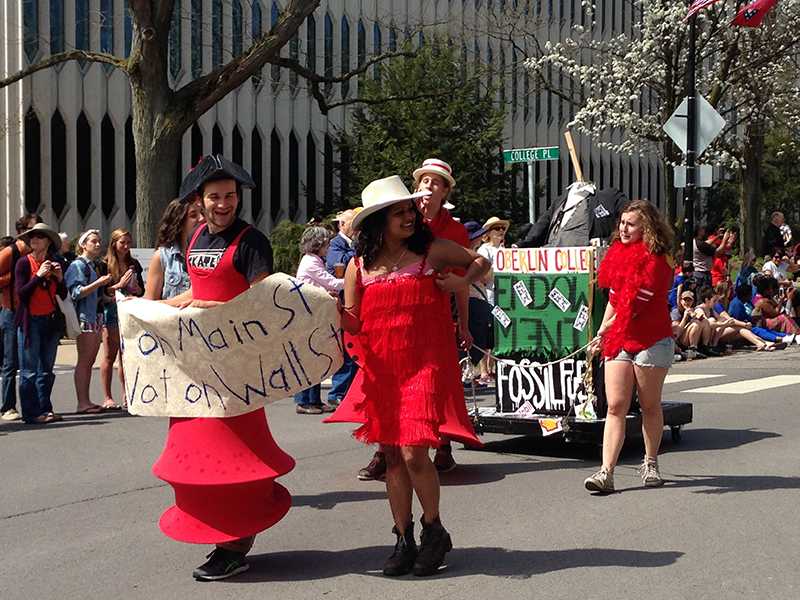 A group of students in favor of divesting the College from fossil fuels march in the Big Parade on Saturday, May 2. Students have submitted a divestment proposal to the Board of Trustees.
