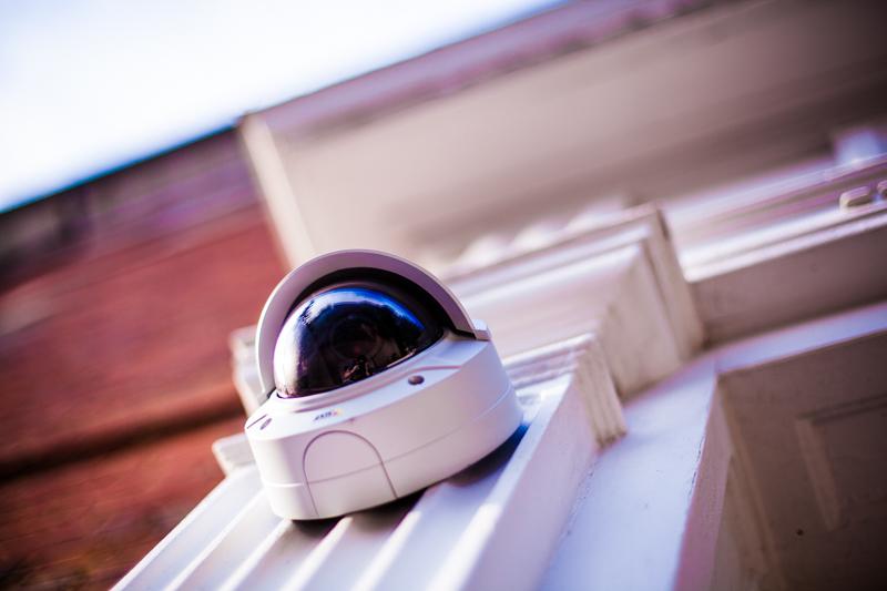 A security camera surveys campus from its perch above a Noah Hall entrance. The administration installed 145 new cameras on the entrances of ￼dorms over the summer.