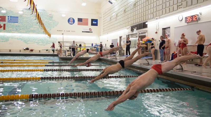 Two Yeomen catapult off the starting blocks in Oberlins dual meet against the Wittenberg University Tigers Saturday, Nov. 14. The swimming and diving team anticipates competitive races across the board at the Fredonia Invitational this weekend.