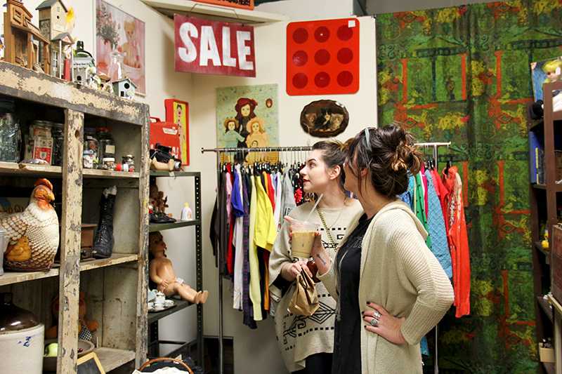 Two customers shop at Ratsys new location on South Main Street. The store moved after the New Year. 