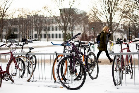 A student walks past bikes locked to a rack outside the King Building. The Oberlin Police Department is launching a new safety initiative that aims to reduce the city’s traffic violations.