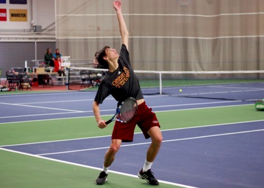 Junior Abe Davis lofts the ball up to serve to Fernando Sousa and Mikel Oscoz of Indiana Tech Saturday. Davis and his senior partner Callan Louis defeated their Indiana Tech opponents 8–5 in doubles action, and the duo each earned wins in singles play to contribute to the Yeomen’s 6–3 win in the afternoon.