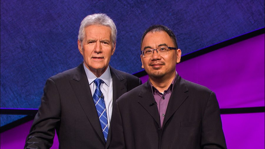 Assistant Professor of Music Theory Andrew Pau joins host Alex Trebek on the Jeopardy! set before one of Pau’s six consecutive wins. He excelled in various topics, including Shakespeare and U.S. governors.