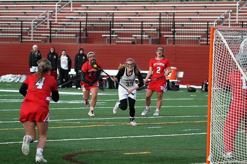 enior midfielder Grace Barlow charges toward goal in the Yeowomen’s game against the Wittenberg University Tigers April 13. Barlow led her squad with four goals in the contest, but the Yeowomen were defeated by a score of 12–10. 