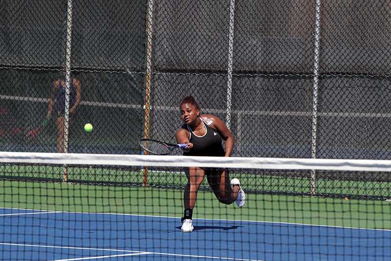 inSenior
Ariana Abayomi swings a forehand over the net in singles play. The Yeowomen beat the Gators 7–2 Saturday in the final match of their regular season.
