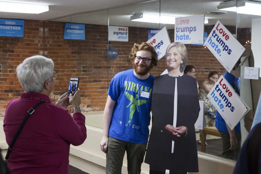 College sophomore poses for a photo at the Clinton office opening on Thursday. The Clinton campaign uses the office as a hub for
volunteers to phone bank and canvass.