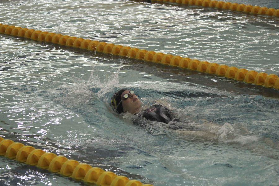 Senior captain Nora Cooper swims in Oberlin’s first home meet of the season against Hiram College. The Yeowomen earned 141 points to defeat the Terriers.