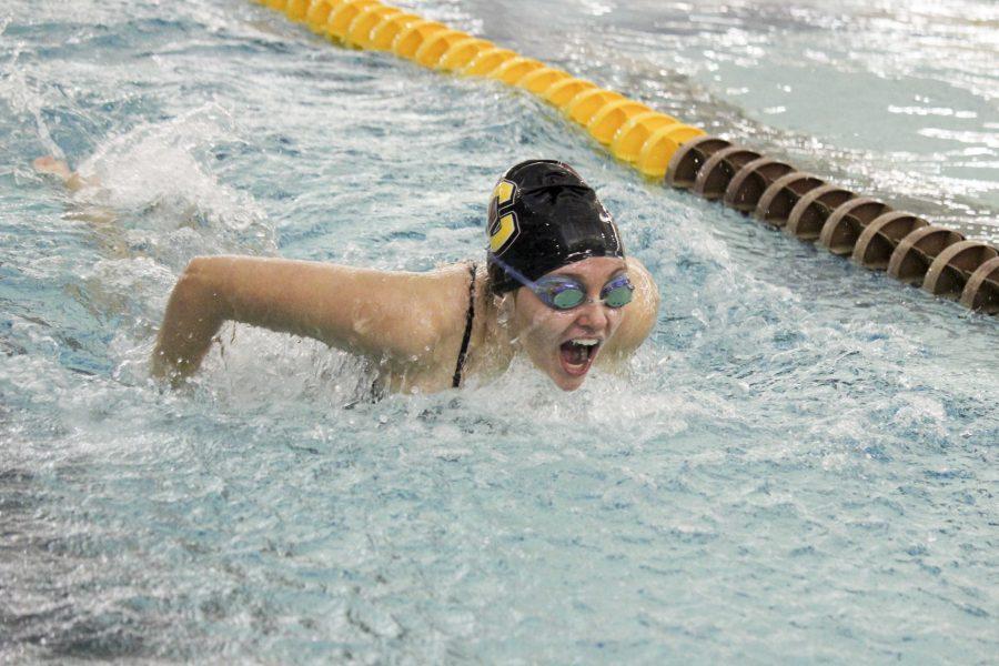 First-year Paige Davies races in the 200-yard butterfly. The swimming and diving teams begin the Fredonia Invitational in Fredonia, NY, today. 