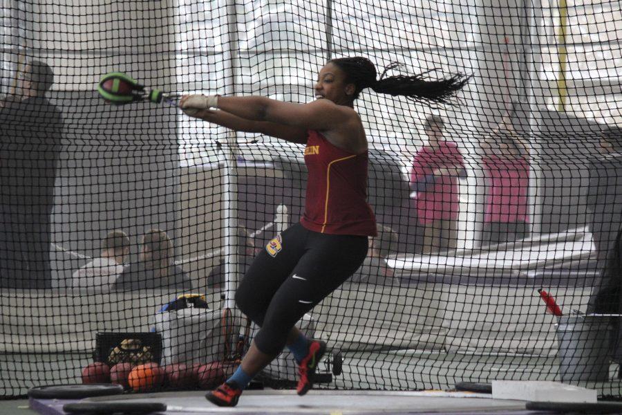 Junior thrower and three-time All-American Monique Newton launches the shot put. A Sacramento, CA native, Newton is also a track and field team captain. 