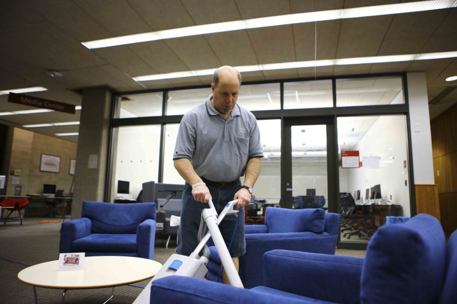 Jeff  Mazze at Mudd library is one of the remaining custodial staff  members after many took the Colleges staff  buyout program. Twenty-one members of his union, UAW, left their positions at the end of 2016.