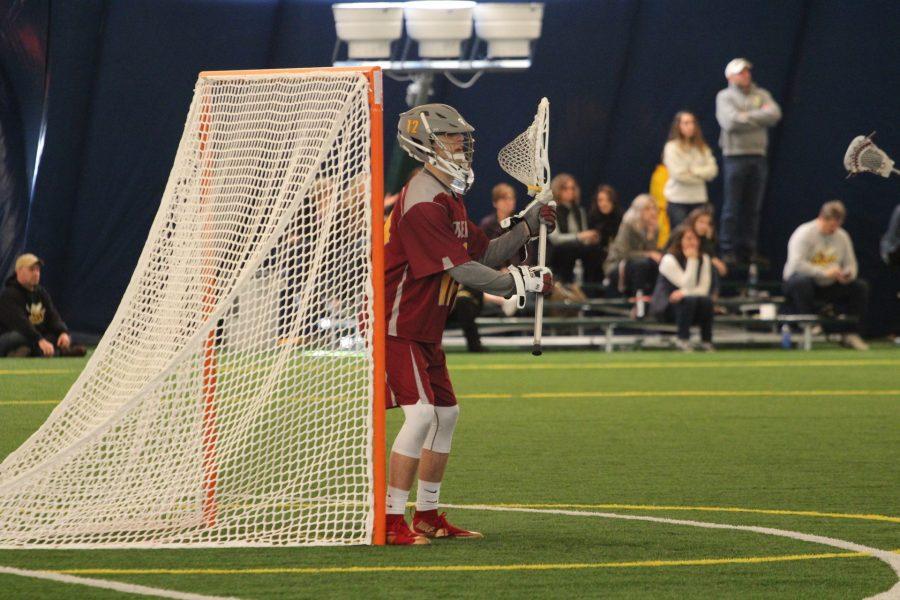 First-year Calvin Filson plays goalie against the Baldwin Wallace University Yellow Jackets. Last weekend, Oberlin dropped its first two games of the 2017 season.