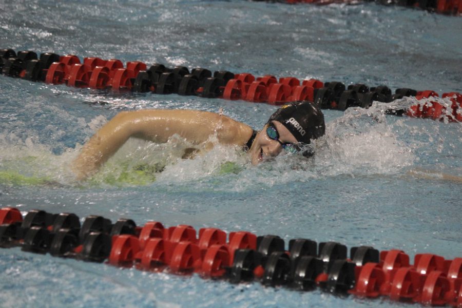 Senior Maddie Prangley swims the freestyle at the NCAC Championships. Prangley broke the 1,650 freestyle program record with a time of 17:32.28 to secure a seventh-place finish.
