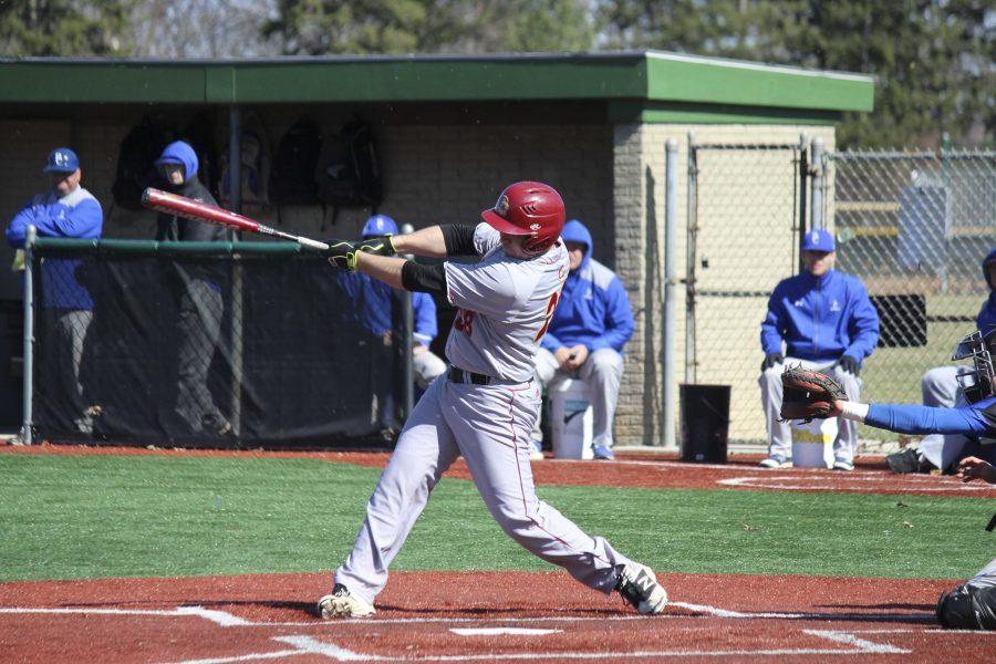 Senior Brian Carney drills a three-run home run in Oberlins 12–1 season-opening win over Berea College Wednesday. The Yeowomen were also victorious in game two of the doubleheader, winning 17–0.