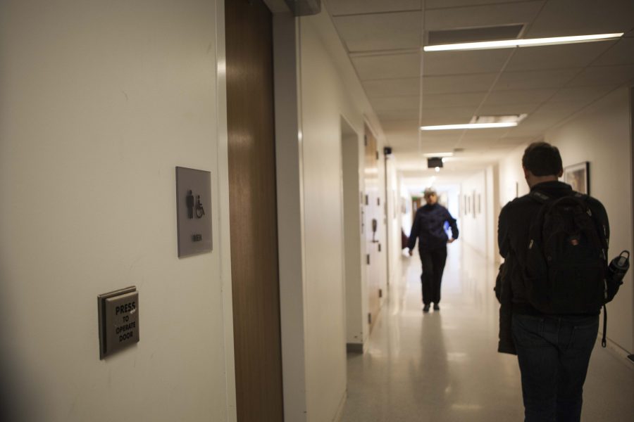 Students pass a men’s restroom in Bibbins Hall, a Conservatory building that has no gender-neutral bathrooms. Renovations this summer will address this issue as gender-neutral bathrooms will be included on the first- and third-floors of the building.