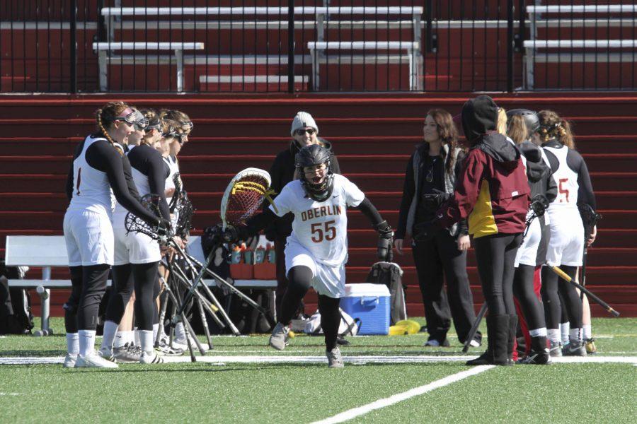 Sophomore+goalie+Siena+Marcelle+runs+through+a+tunnel+of+teammates+onto+the+field+in+Oberlin%E2%80%99s+home+opener+against+Kalamazoo+College+March+4.+The+Yeowomen+will+continue+conference+play+when+they+travel+to+take+on+Ohio+Wesleyan+University+at+1+p.m.+tomorrow.