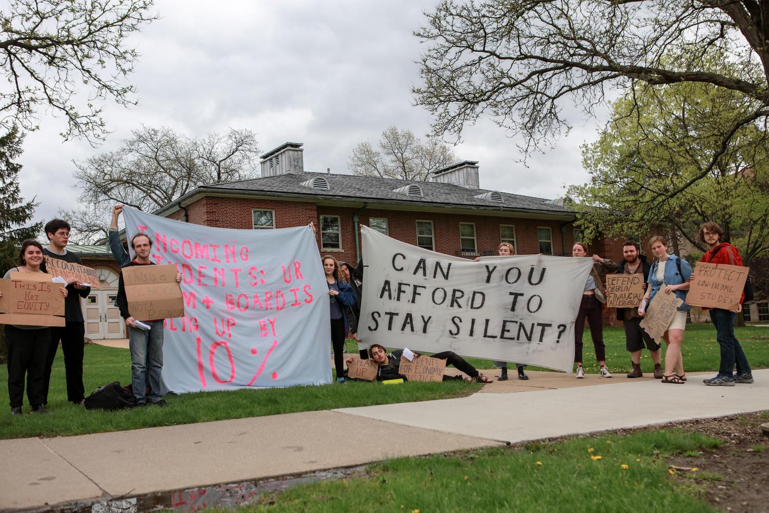 Students protest against the administration’s new housing, dining and OSCA financial aid policies last Friday. The protest was one of many actions in opposition to the changes, leading to today’s meeting between OSCA officers and the administration.