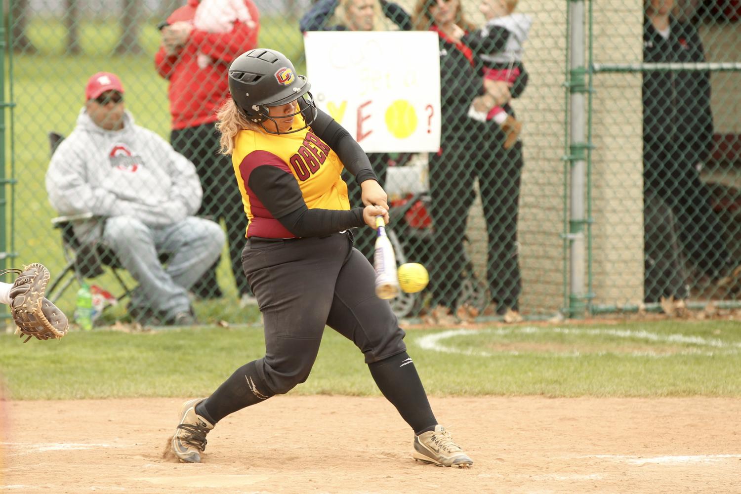 Senior captain Grace Evans connects with a pitch against Wittenberg University on Senior Day last Saturday. The Yeowomen finished their season 12–28 overall and 2–14 in the NCAC.