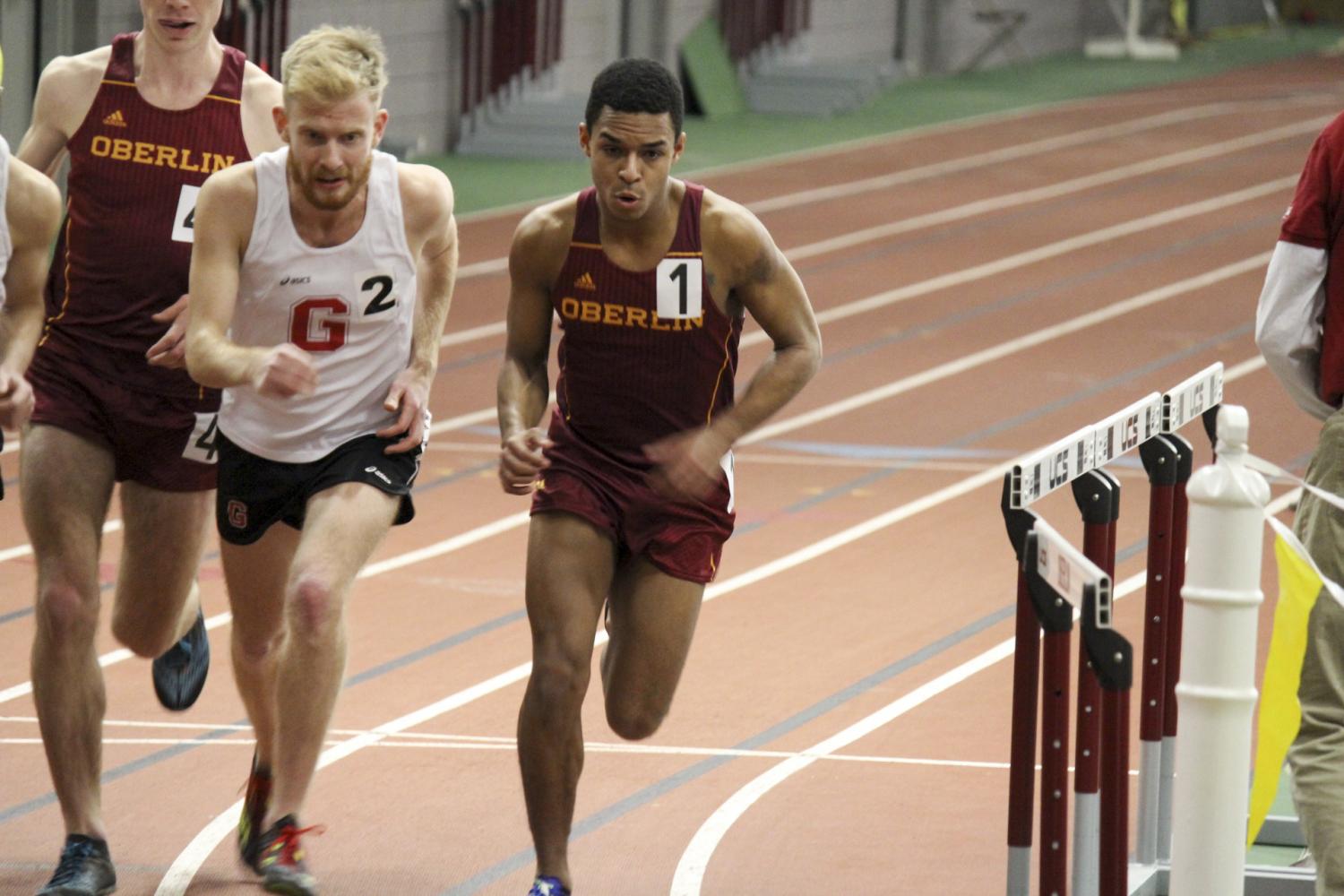 Senior captain E.J. Douglass edges past a Grove City runner in the Dan Kinsey Invitational in February. This weekend, track and field will head to Hillsdale College in Hillsdale, MI, and Ashland University in Ashland, Ohio.