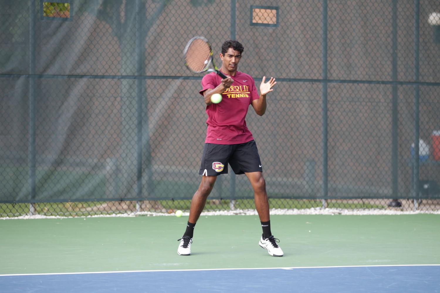 Junior Manickam Manickam completes a forehand follow-through. The Yeomen completed their season with a 5–2 victory over Denison University in the third-place match of the NCAC Tournament.