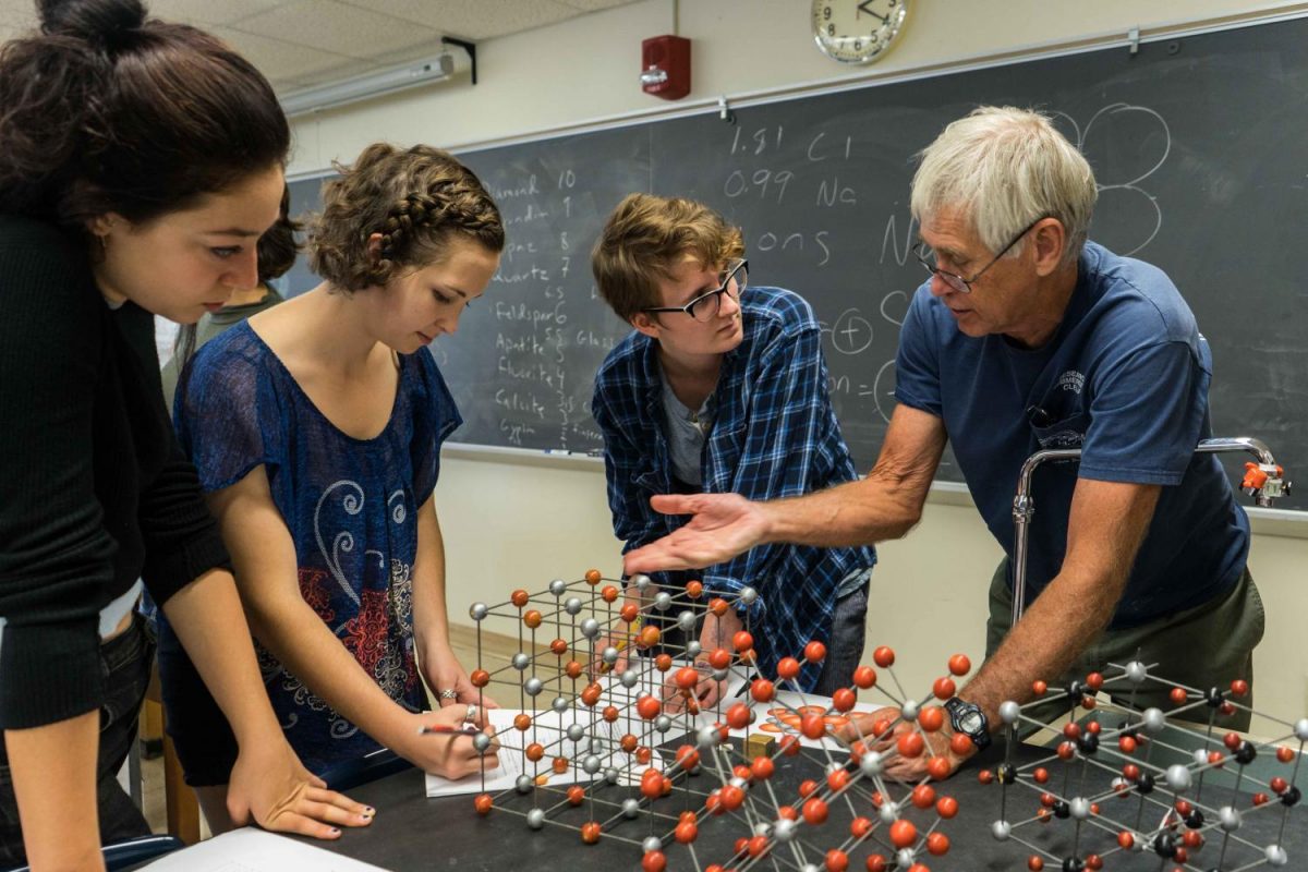 Professor of Geology Dennis Hubbard guiding students in an Earth’s Environments lab. The Geology department is one of the many departments facing staffing concerns after the College announced a hiring freeze this semester. 