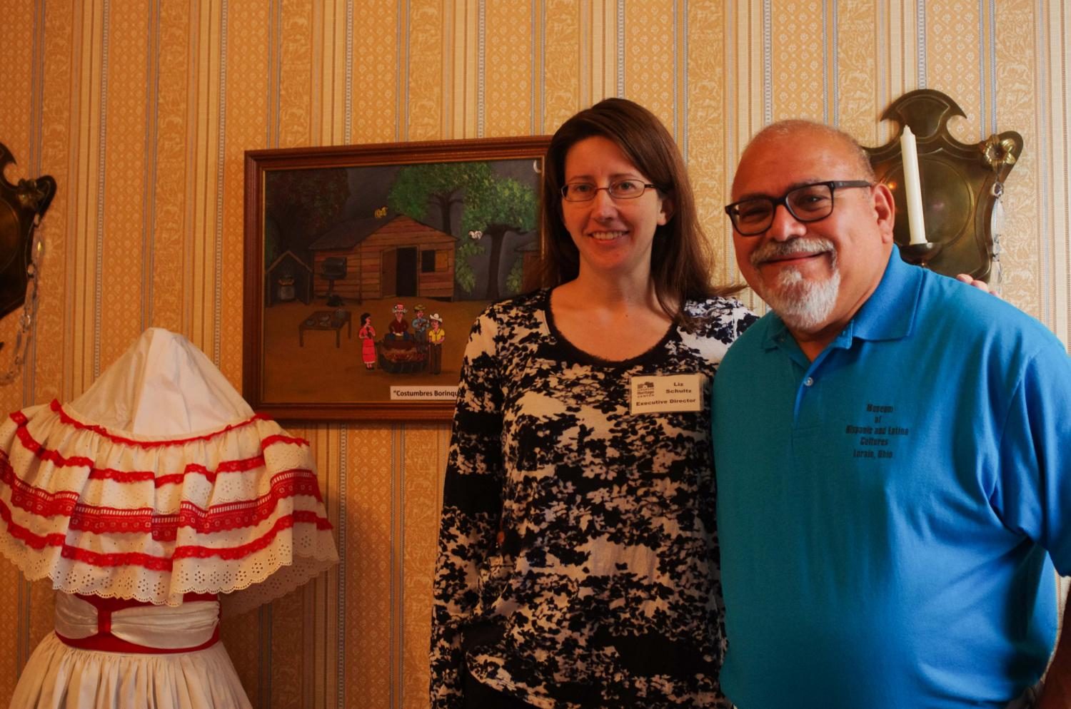 Liz Schultz (left), executive director of the Oberlin Heritage Center, and Guillermo Arriaga, president and director of the Museum of Hispanic and Latino Cultures of Lorain, have collaboratively curated an exhibition on Hispanic and Latino culture. that will be open to the public in Monroe House through September.