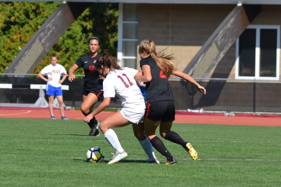First-year midfielder Sydnie Savarese fights for the ball in the Yeowomen’s face-off against the Ohio Wesleyan University Battling Bishops Sept. 23. The Yeowomen will take the field tomorrow night against the Hiram College Terriers in Hiram, Ohio.