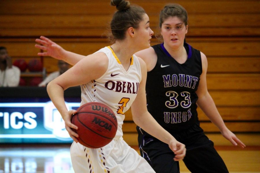 Sophomore guard Ally Driscoll tries to move the ball past a defender in last season’s Nov. 28 loss to the University of Mount Union Purple Raiders. Wednesday, she scored a team-high 14 points in their 44–65 season opening loss to the Purple Raiders.