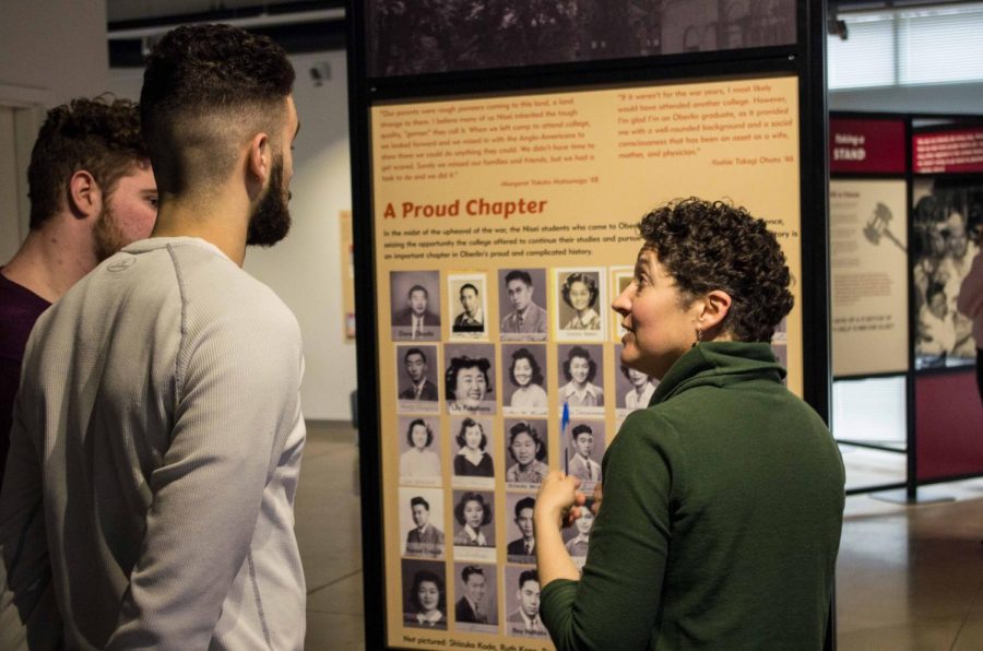 Professor Renee Romano discusses the nationally-touring exhibit “Courage and Compassion” with sophomores Justin Godfrey and Abe Kuhn.