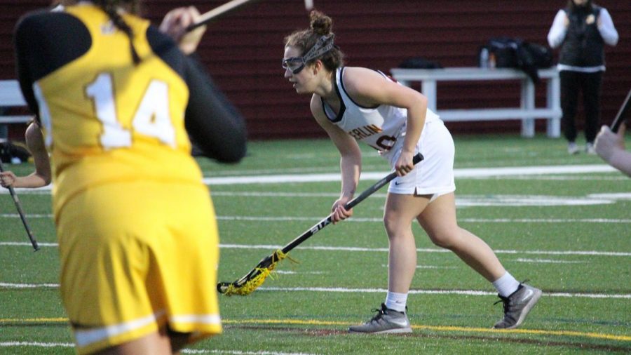 Senior Natalie Rauchle readies herself in the Yeowomen’s 16–5 loss to the John Carroll University Lobos on March 24. She earned NCAC Player of the Week this week, in part because of her eight-goal performance against the Wittenberg University Tigers.