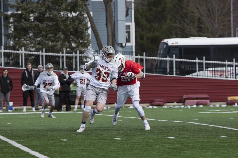 Senior attack Ian McCague drives to the net against a Denison University defender April 7. McCague enjoyed a successful senior season, ending with 16 goals and five assists for a total of 21 points at the Yeomen’s final game last Saturday.
